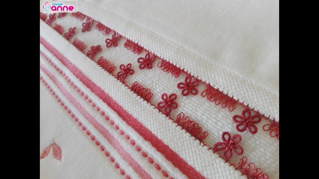 Balm shuttle, needle-punched towel edge construction